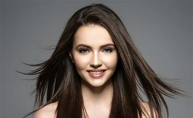 model posing smiling with hair down